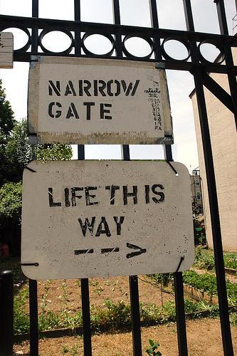 sign that says narrow gate life this way